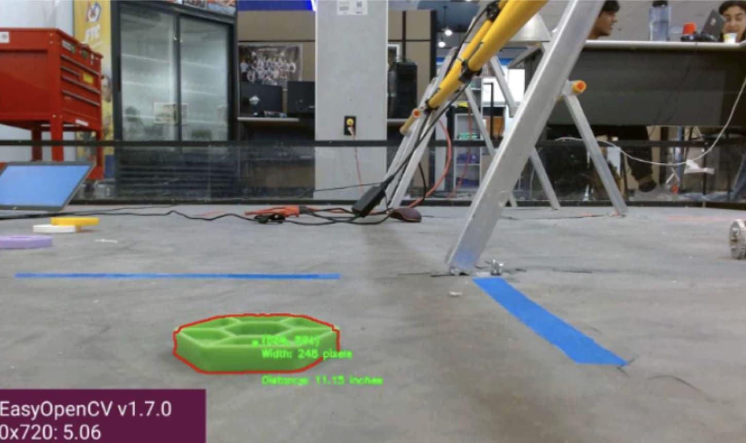 Camera frame with a hexagonal game piece outlined and its estimated distance printed