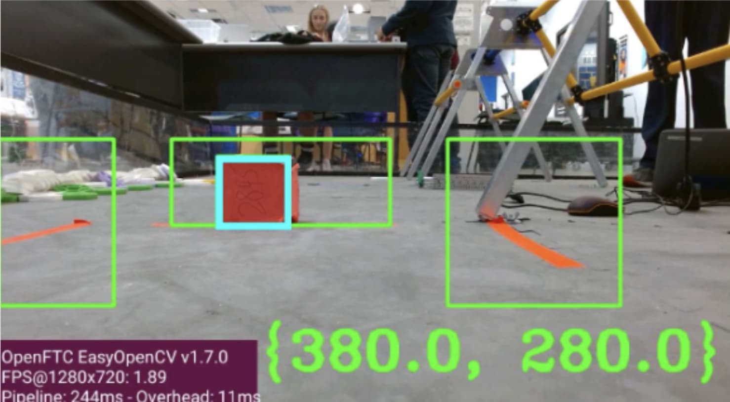 Camera frame with a red cube detected inside the centre path region